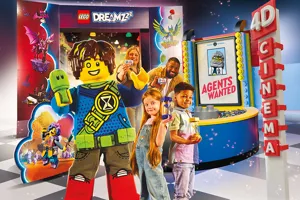 Family of 4 viewing LEGO Dreamzzz 4D cinema movie at LEGO Discovery Center Boston